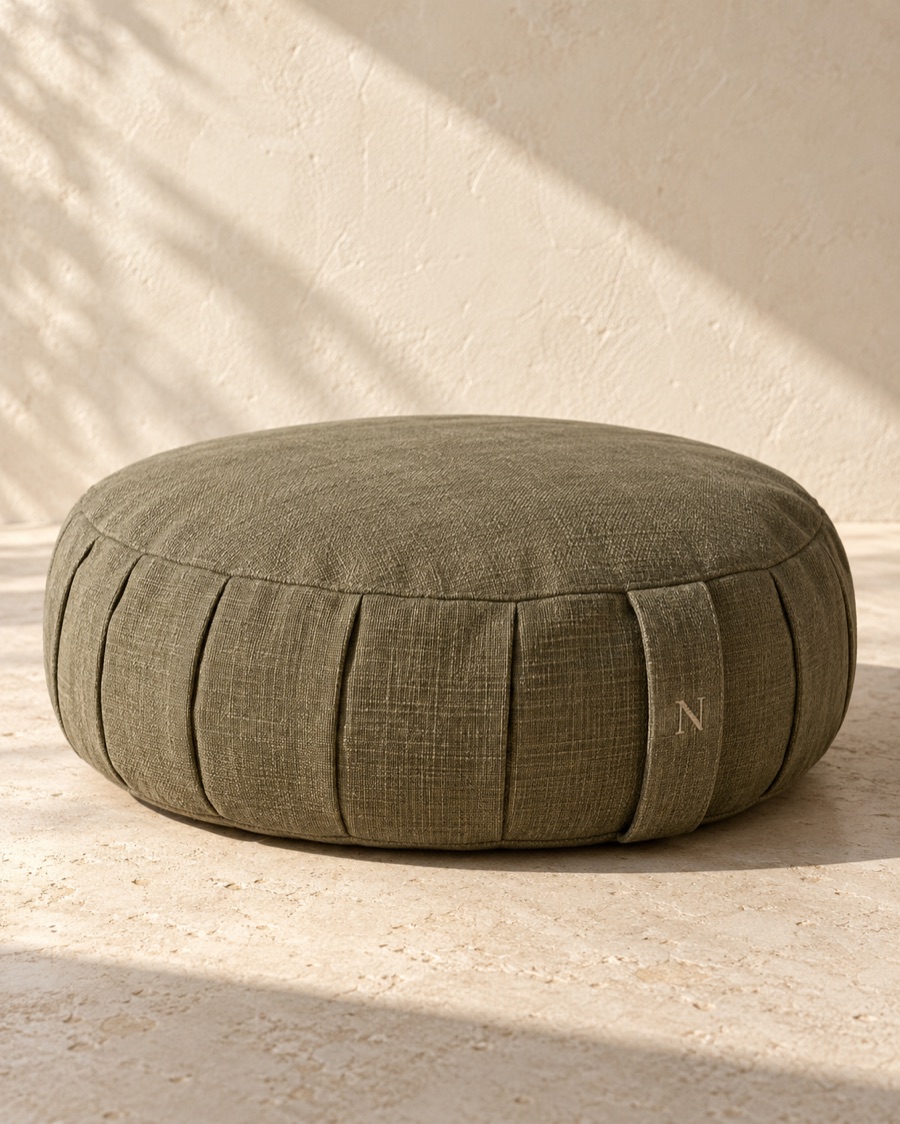 NOSTOS concept quiet cushion, photographed on warm limestone.