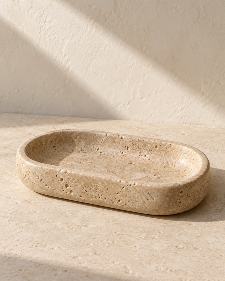 NOSTOS concept stone tray in limestone, photographed on warm limestone.